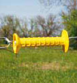 PATRIOT ELECTRIC FENCE 16' SPRING GATE KIT with yellow gate handle on farm